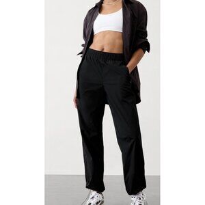 New! ATHLETA Rise Pant #472261 Size L Black Bungee Hem Zip Pocket Nylon Blend